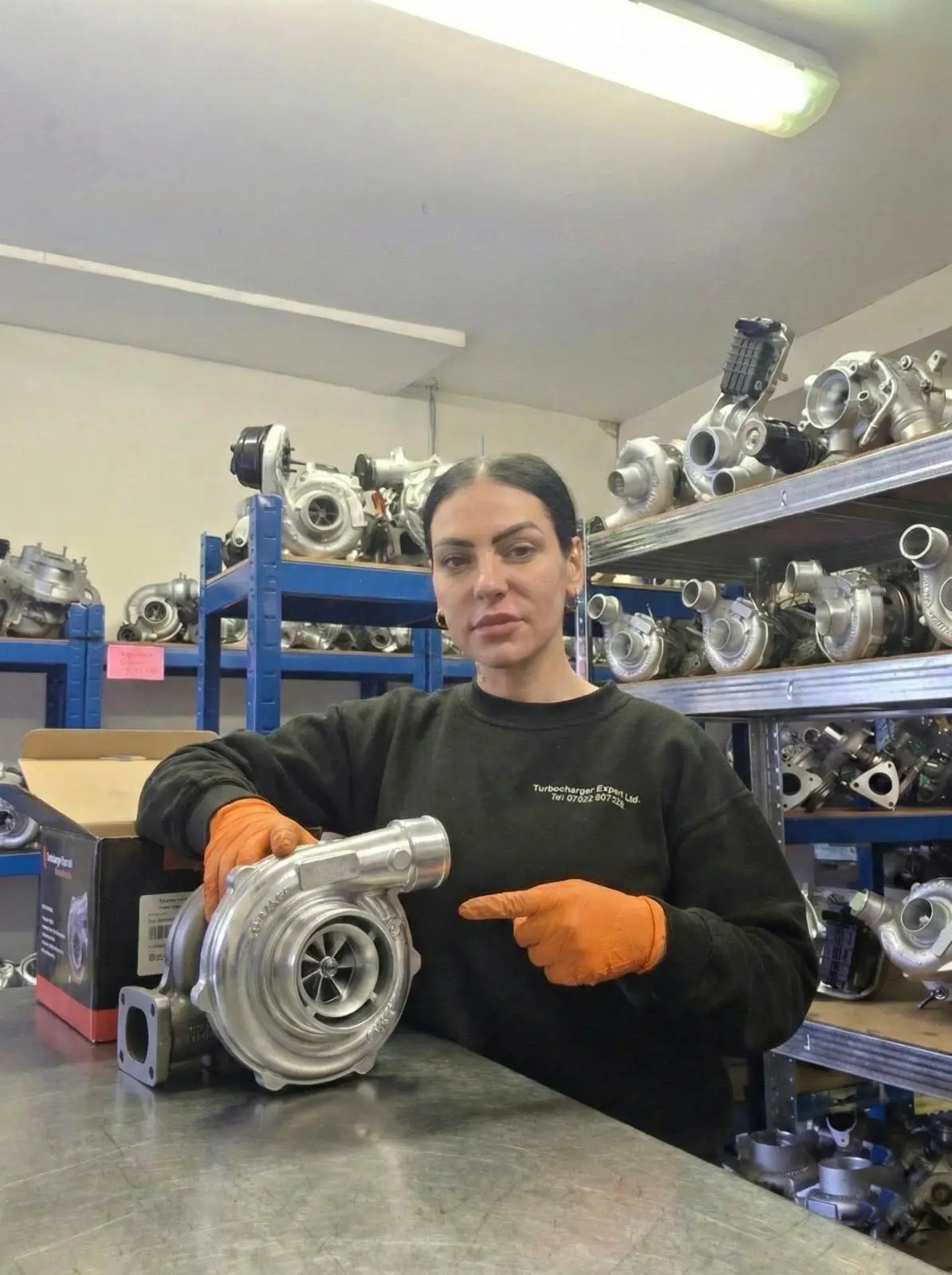 Technician holding turbocharger