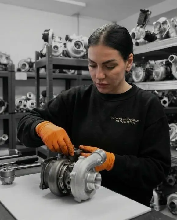 Technician inspecting turbocharger